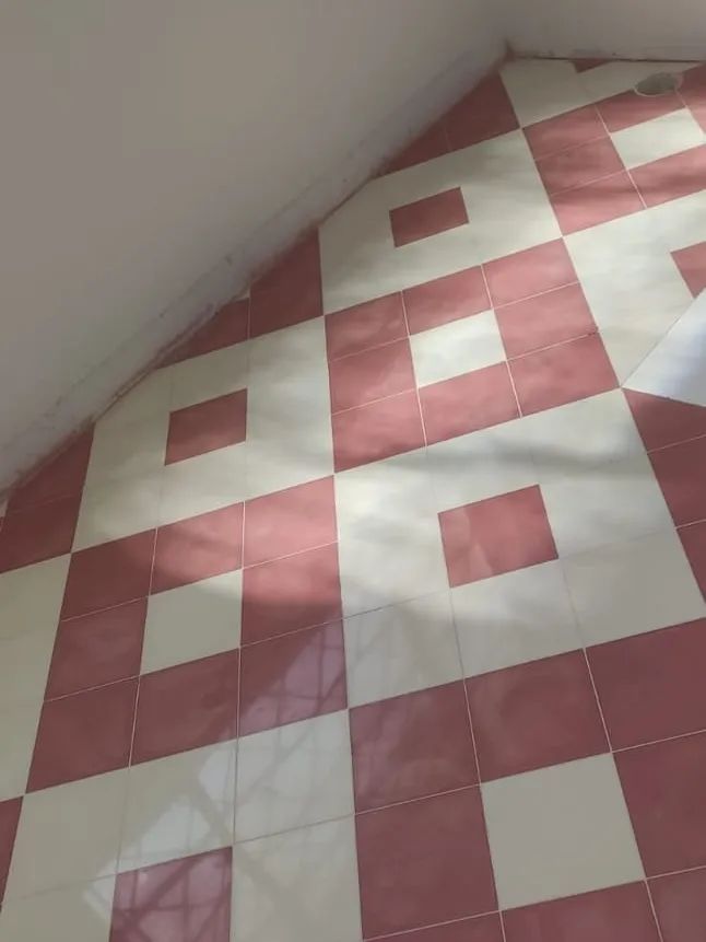 Pink and white diamonds set on a polished tile floor